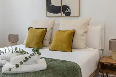 Cama o camas de una habitación en Waou Urban Chamberi XVII - Corta Duración