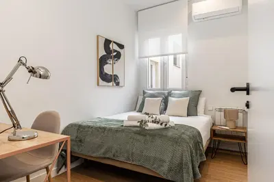 Cama o camas de una habitación en Waou Urban Chamberi XVII - Corta Duración