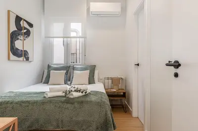 Cama o camas de una habitación en Waou Urban Chamberi XVII - Corta Duración