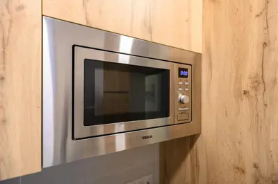 Una cocina o zona de cocina en Apartamento con 2 dormitorios, 2 baños y sofá cama ideal para familias en Madrid Temporal CAR1012