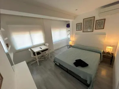 Cama o camas de una habitación en Rooms Mármol, junto a Puerta Toledo