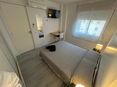 Cama o camas de una habitación en Rooms Mármol, junto a Puerta Toledo