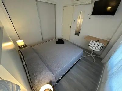 Cama o camas de una habitación en Rooms Mármol, junto a Puerta Toledo