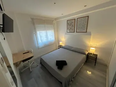 Cama o camas de una habitación en Rooms Mármol, junto a Puerta Toledo