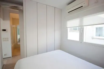 Cama o camas de una habitación en Refugio soleado sobre los tejados de Chueca