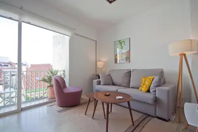 Zona de estar de Refugio soleado sobre los tejados de Chueca