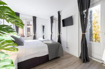Cama o camas de una habitación en Amati Boutique Coliving Madrid