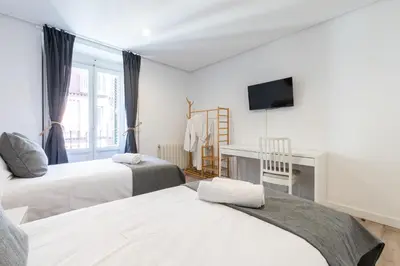 Cama o camas de una habitación en Amati Boutique Coliving Madrid