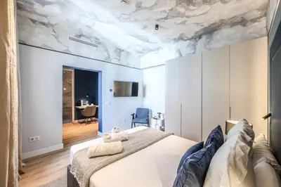 Cama o camas de una habitación en ColivINN Plaza Mayor II