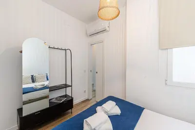 Cama o camas de una habitación en Queen's Malasaña Boutique I - Alojamiento corta estancia