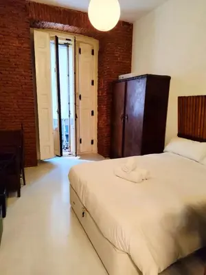 Cama o camas de una habitación en Estudio luminoso en plaza de España by beBalmy