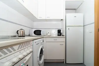Una cocina o zona de cocina en Apartamentos Plaza de España