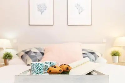 Cama o camas de una habitación en Apartamentos Plaza de España