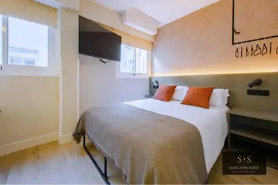 Cama o camas de una habitación en Santa Sofia Suites