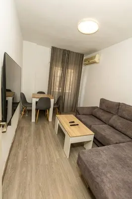 Una televisión o centro de entretenimiento en Apartament with balcony