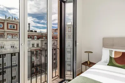 Cama o camas de una habitación en Waou Ático 2 Terrazas Gran Via - Corta Duración