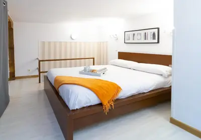Cama o camas de una habitación en Apartamentos Puerta Del Sol I