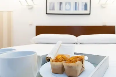 Cama o camas de una habitación en Apartamentos Puerta Del Sol I