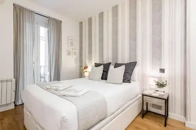 Cama o camas de una habitación en Esencia en el Corazón de Chueca