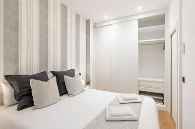 Cama o camas de una habitación en Esencia en el Corazón de Chueca