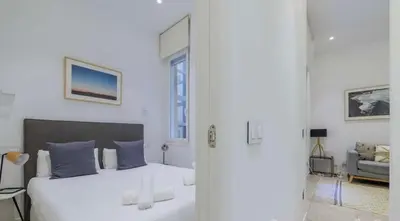 Cama o camas de una habitación en Warm 1BR in the Vibrant Chueca Neighborhood