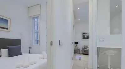 Cama o camas de una habitación en Warm 1BR in the Vibrant Chueca Neighborhood