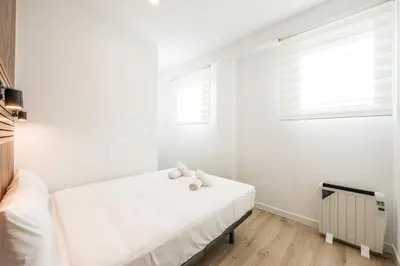 Cama o camas de una habitación en Elegant Space for Your Madrid Stay