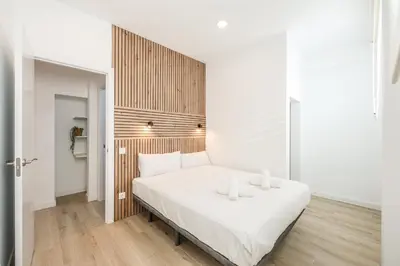 Cama o camas de una habitación en Elegant Space for Your Madrid Stay