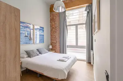 Cama o camas de una habitación en Bonito apartamento Prosperidad