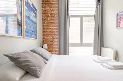 Cama o camas de una habitación en Bonito apartamento Prosperidad
