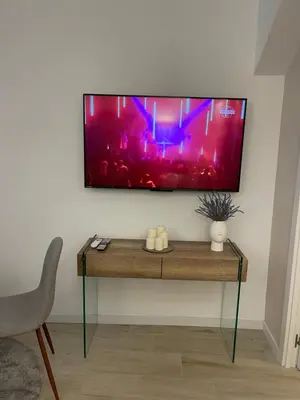 Una televisión o centro de entretenimiento en New Apartment Centro