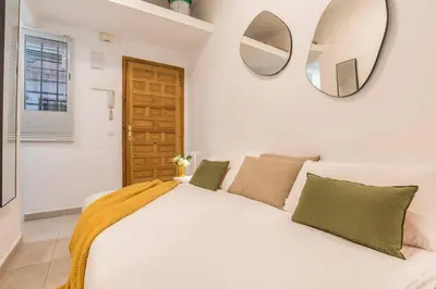Cama o camas de una habitación en Cosy apartment Tribunal
