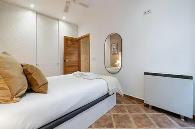 Cama o camas de una habitación en GuestReady – Stylish Flat in the Heart of Lavapiés