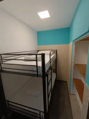 Cama o camas de una habitación en Callao poco yo