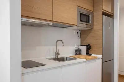 Una cocina o zona de cocina en Waou Urban Home Gran Via I - Corta Duración