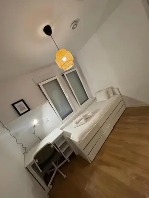 Cama o camas de una habitación en Apartamento para 3 personas cerca de Tirso Molina