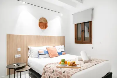 Cama o camas de una habitación en Dobo Madrid Luna