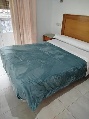 Cama o camas de una habitación en Hostal Rivera Atocha 79