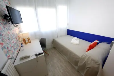 Cama o camas de una habitación en Residencia Universitaria Tagaste Madrid