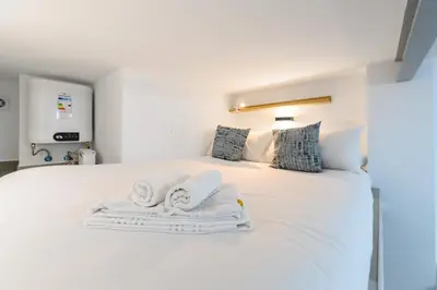 Cama o camas de una habitación en PAS9 Acogedor dúplex en Puente de Vallecas