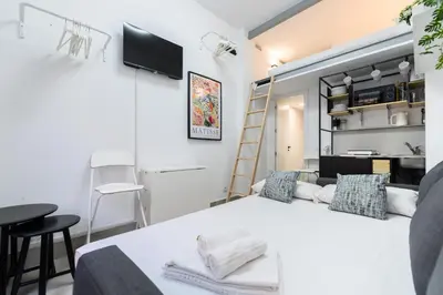 Cama o camas de una habitación en PAS9 Acogedor dúplex en Puente de Vallecas