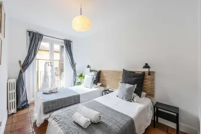 Cama o camas de una habitación en Agora Boutique Coliving Madrid