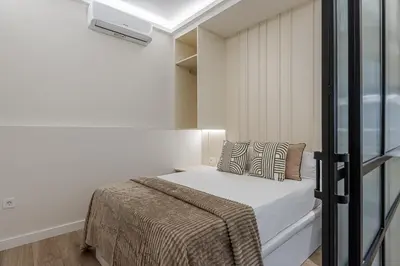 Cama o camas de una habitación en Queen's Chueca Boutique IV - Alojamiento corta estancia