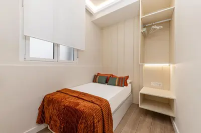 Cama o camas de una habitación en Queen's Chueca Boutique IV - Alojamiento corta estancia