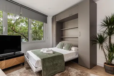 Cama o camas de una habitación en Queen's Serrano Boutique I - Alojamiento corta estancia