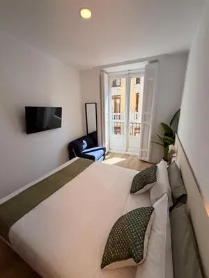 Cama o camas de una habitación en Calle de la Cruz habitaciones