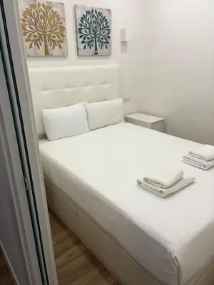 Cama o camas de una habitación en Exyca Malasaña