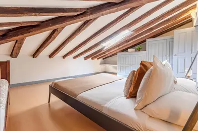 Cama o camas de una habitación en Heima buhardilla de ensueño