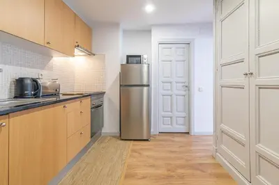 Una cocina o zona de cocina en Heima Madrid letras 3A