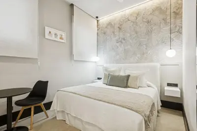 Cama o camas de una habitación en Elegant 2BR Apartment in Conde Duque